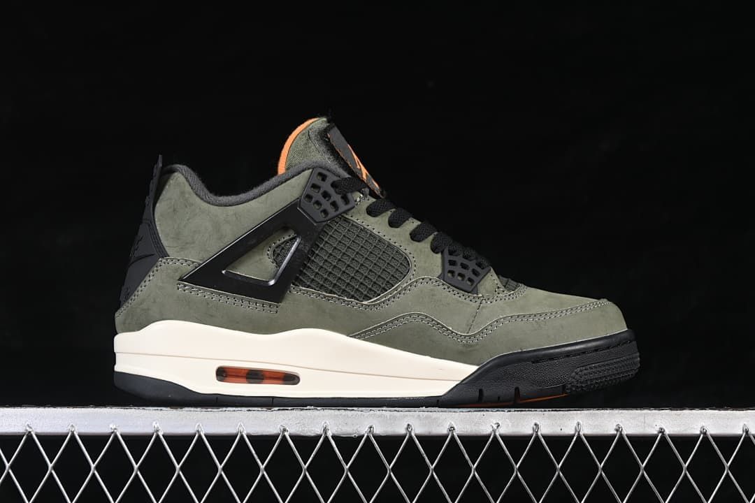 Side profile showing the olive upper, black side cage, cream midsole, and orange heel window
