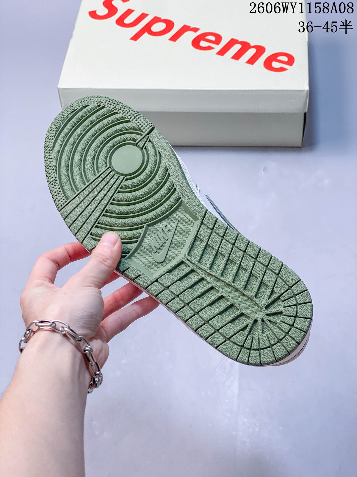 Green outsole with circular traction pattern