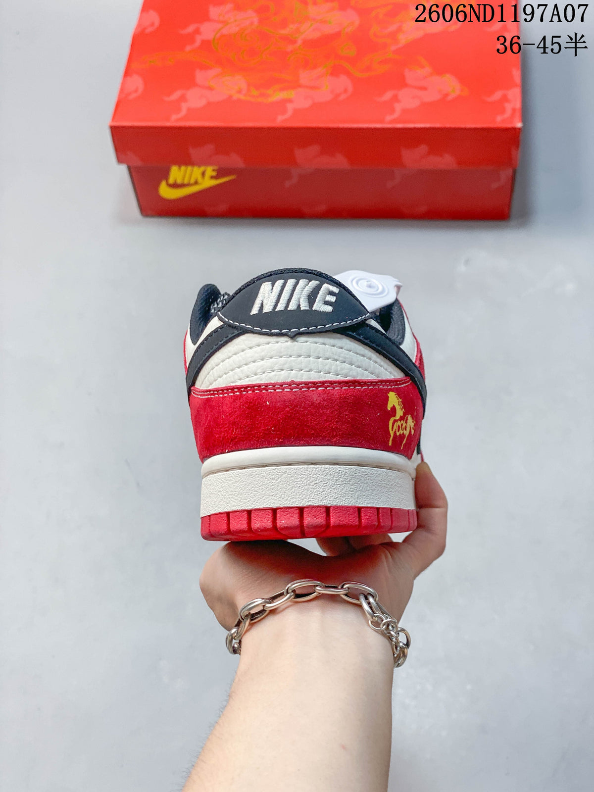 Rear view of the sneaker with a red heel panel and navy collar detail