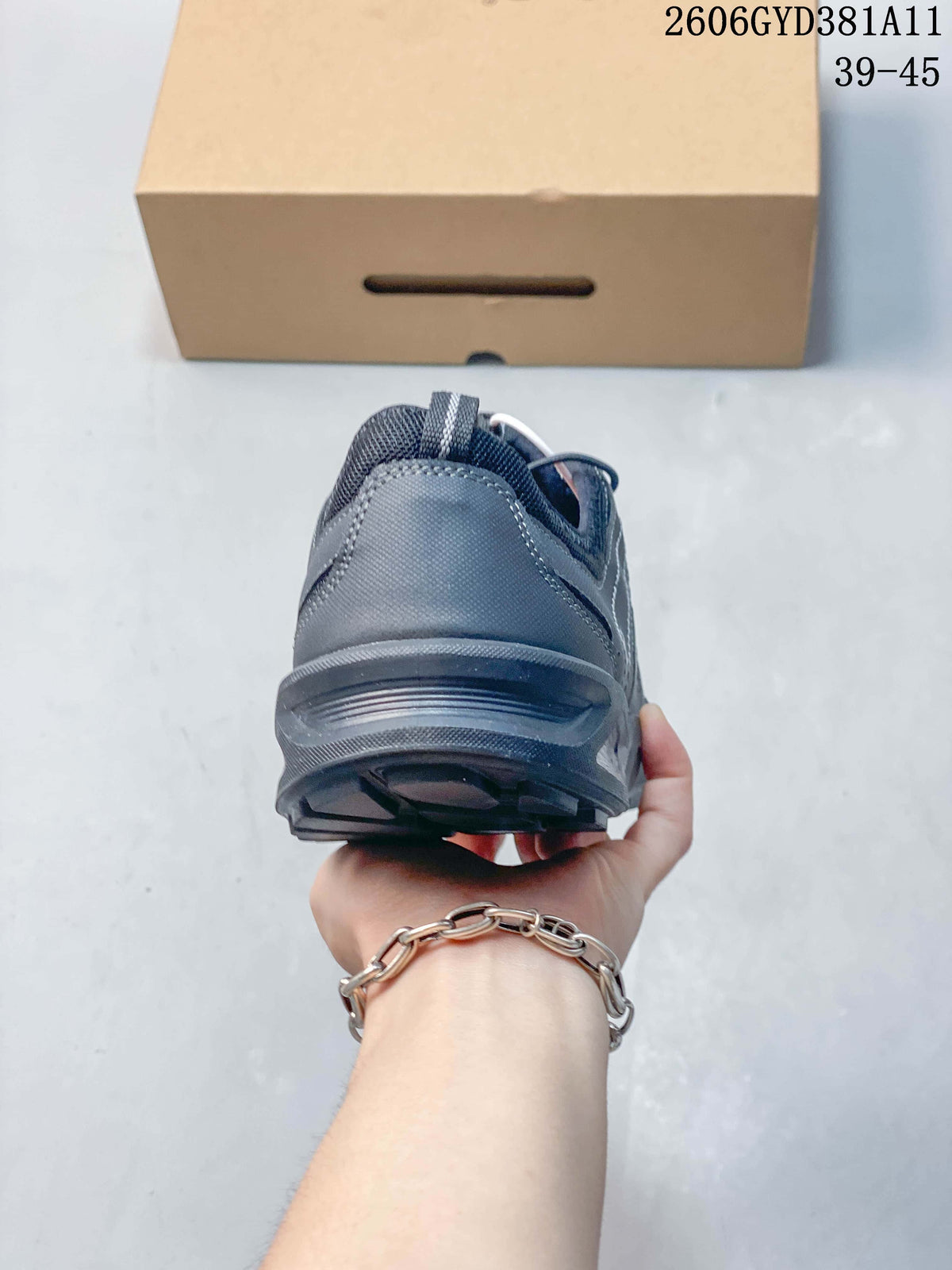 Rear view of a gray sneaker showing the heel and outsole.