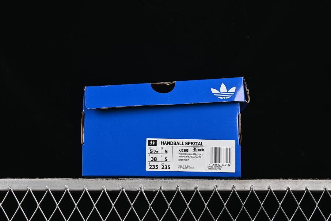 Blue adidas shoe box with a Handball Spezial label showing style code KJ6305 and EU 38