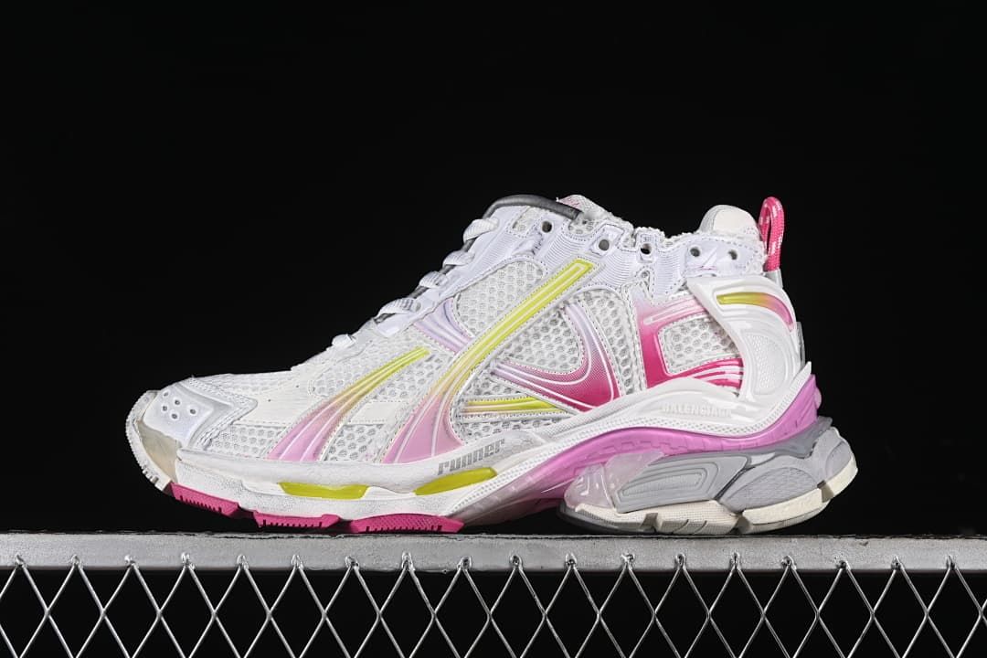 White Balenciaga Runner sneaker with pink and yellow accents, shown in profile.