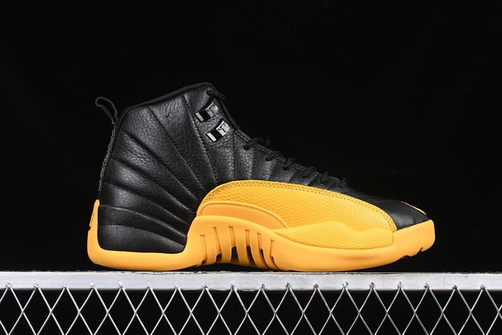 Side profile of a black and gold Air Jordan 12 Retro sneaker