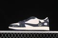 Side view of an off-white and dark navy low-top sneaker with contrast stitching and visible swoosh and Gucci-style details.