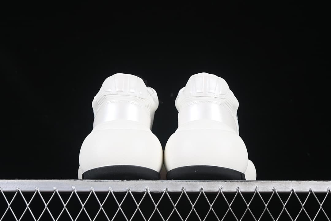 Rear view of the pair highlighting the heel panels and black outsole edges
