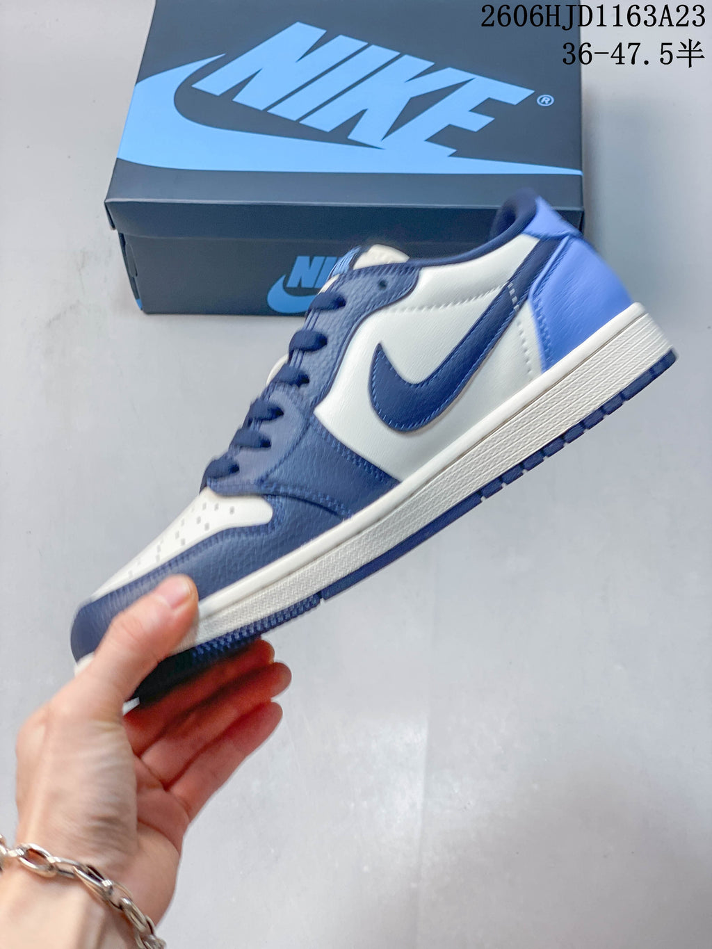 Side view of the blue and white low-top sneaker