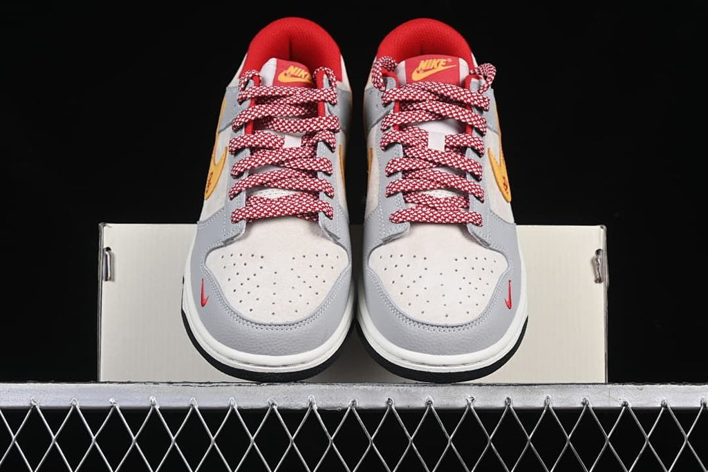 Front view of the pair showing perforated toe panels and red-and-white laces