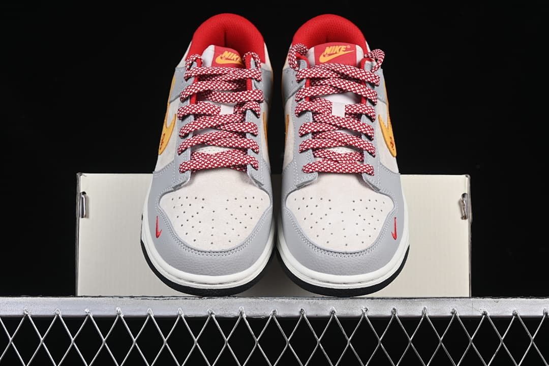 Front view of the pair showing perforated toe panels and red-and-white laces