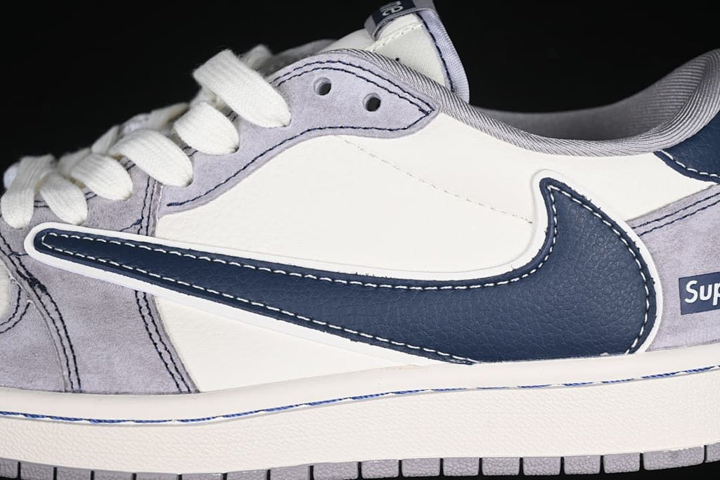 Close-up of navy Swoosh and grey and off-white side panels
