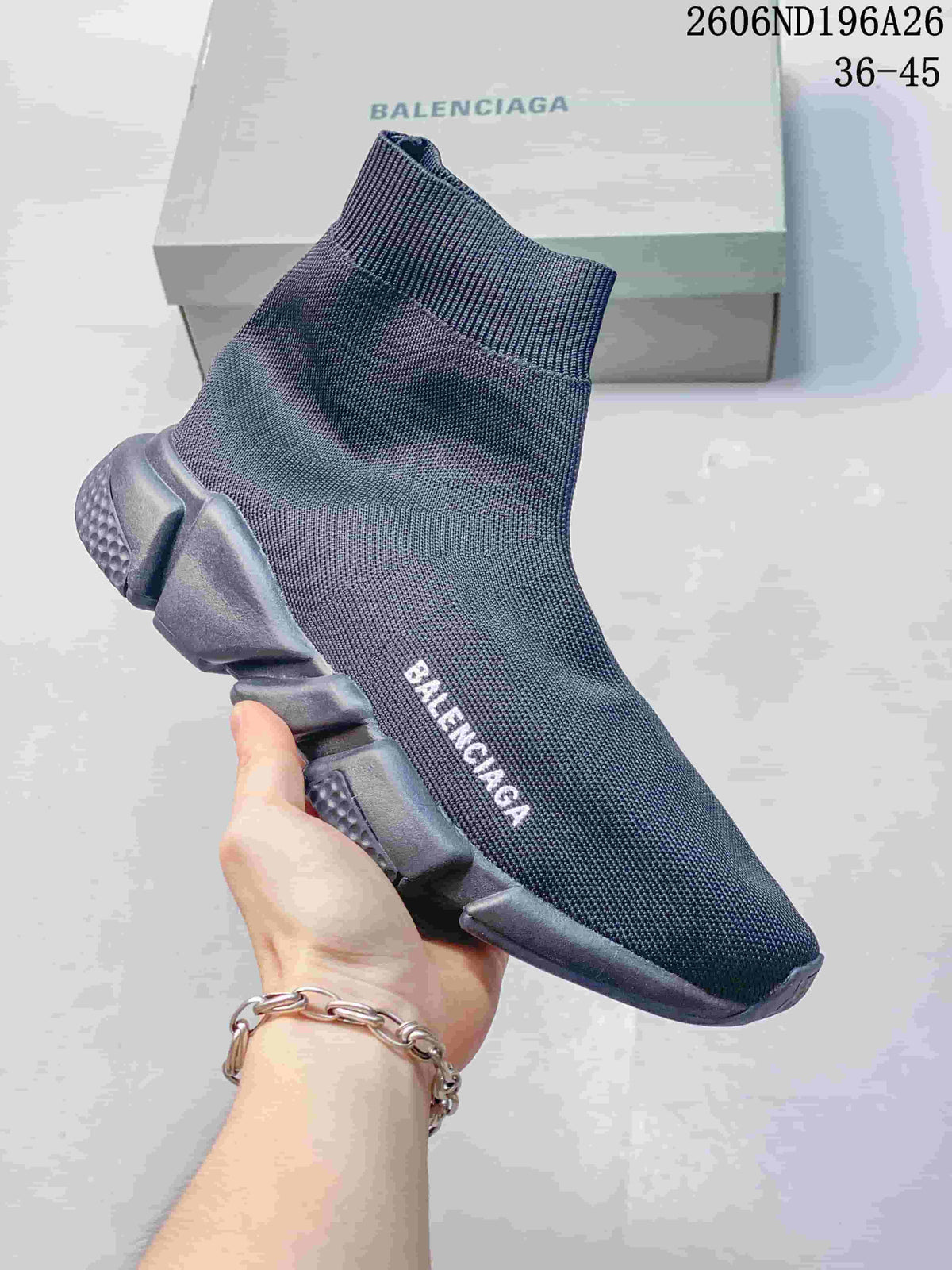Dark knit sock sneaker with a matching dark segmented sole