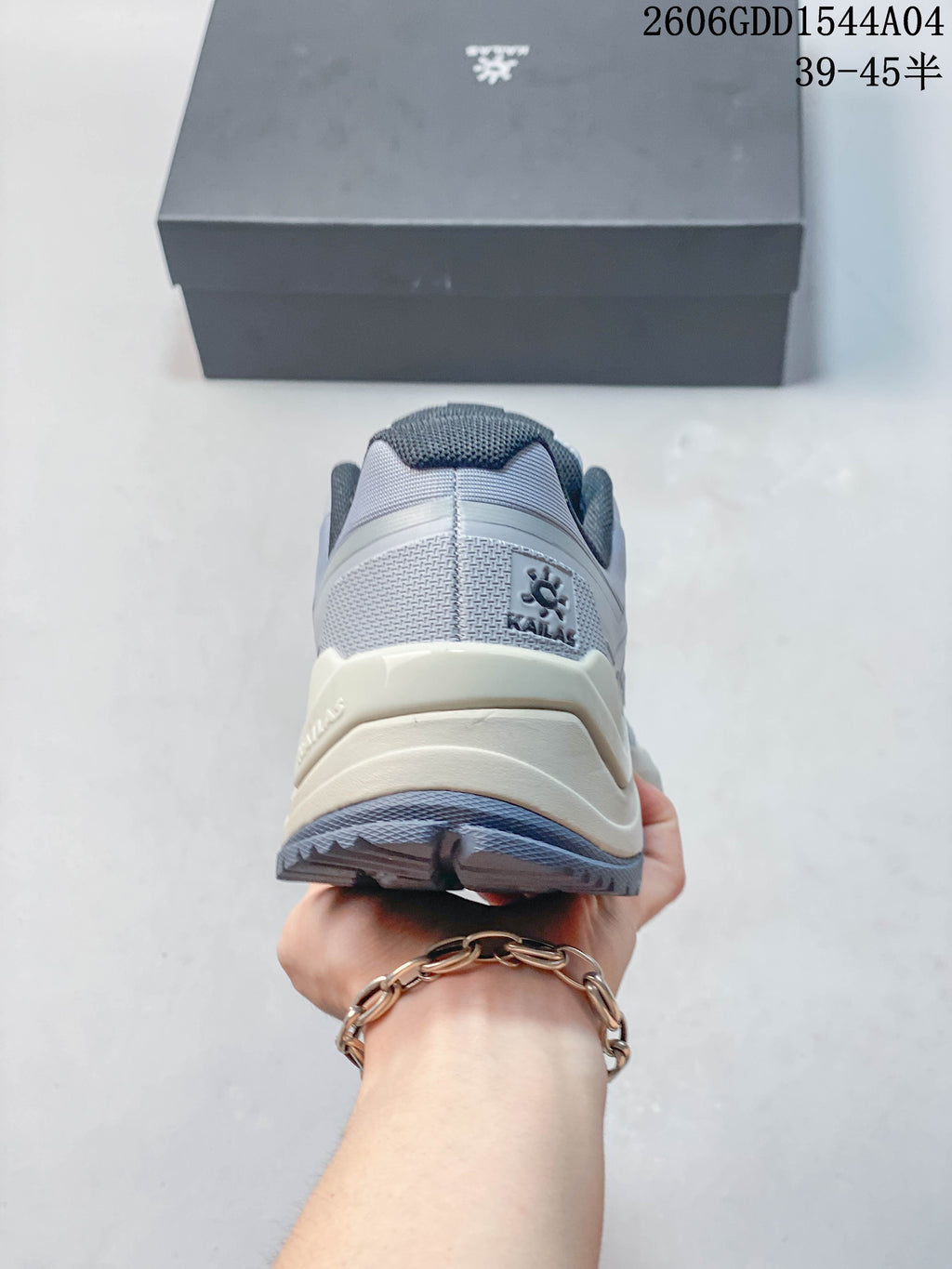 Rear view of a light grey KAILAS hiking shoe.