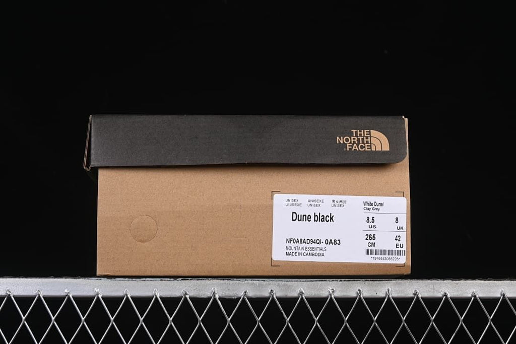 The North Face shoe box label showing Dune Black and sample size EU 42