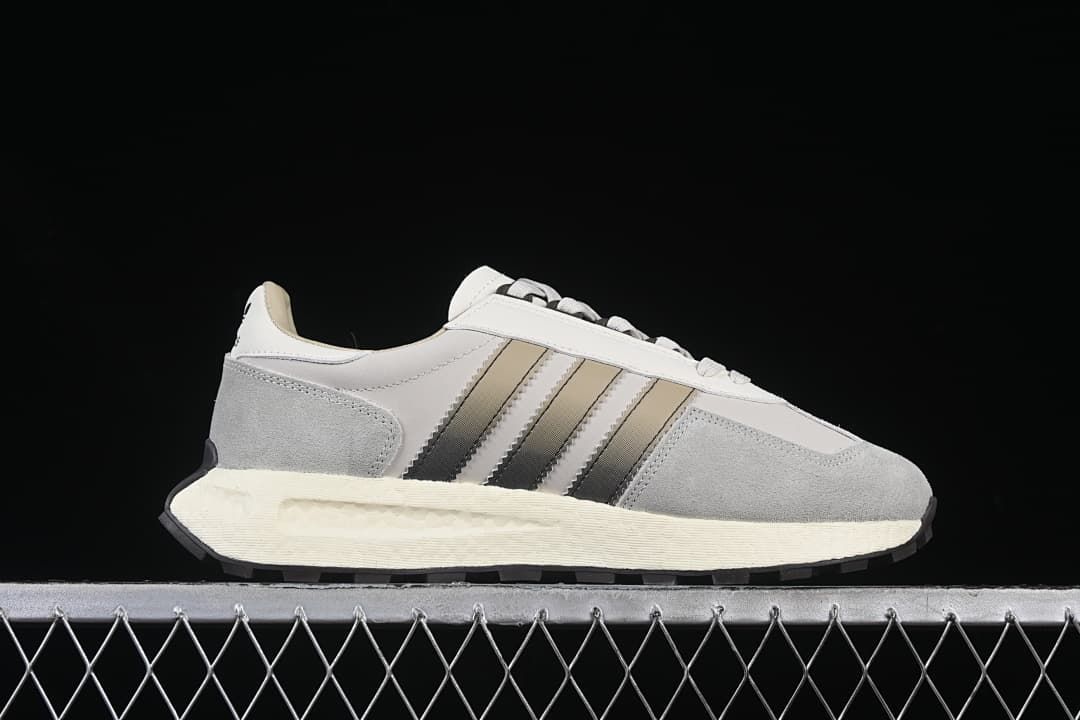 Side profile showing the layered upper, stripe detail, and cream-colored midsole