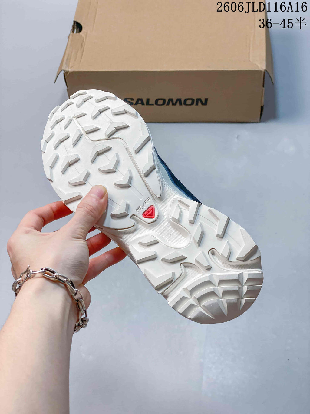 Close-up of the white lugged outsole