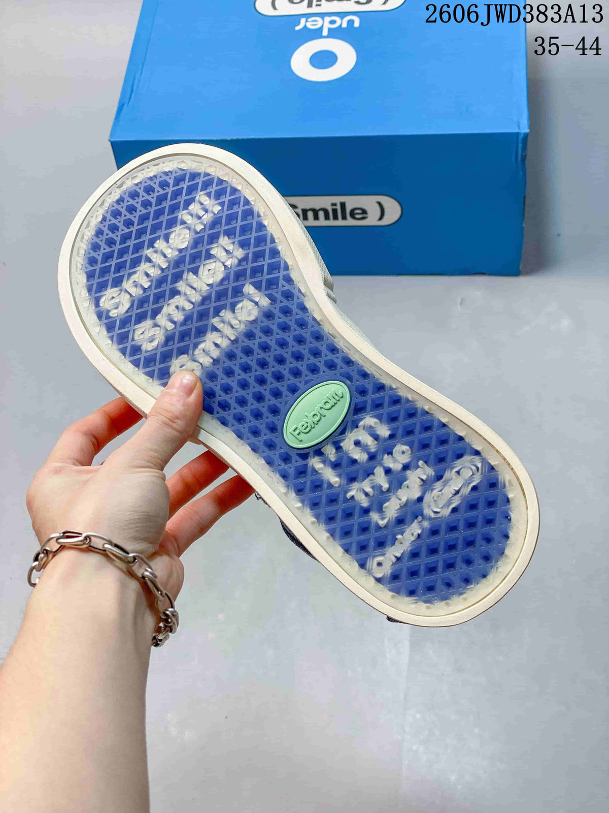 Close-up of the blue patterned outsole on an Ocai Smile sneaker.