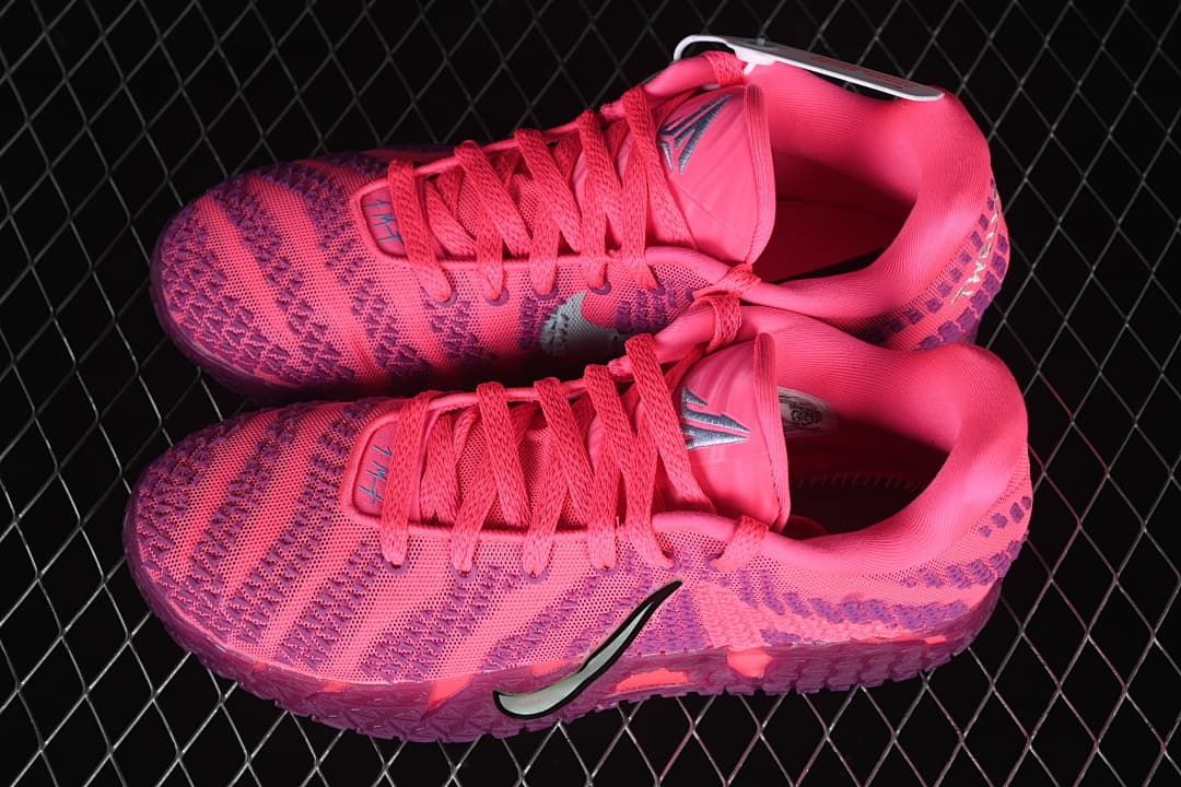 Pair of pink and purple low-top basketball shoes shown from above