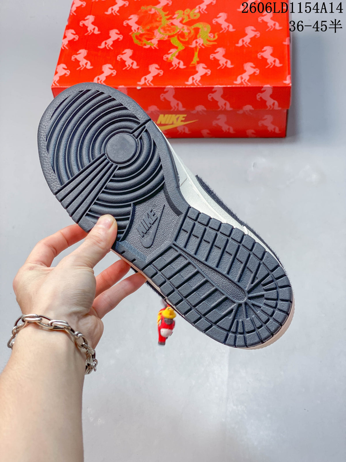 Close-up of the dark textured outsole and red patterned shoe box