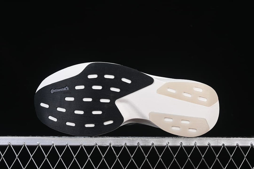 Outsole view showing black and light-colored sections and Continental branding.