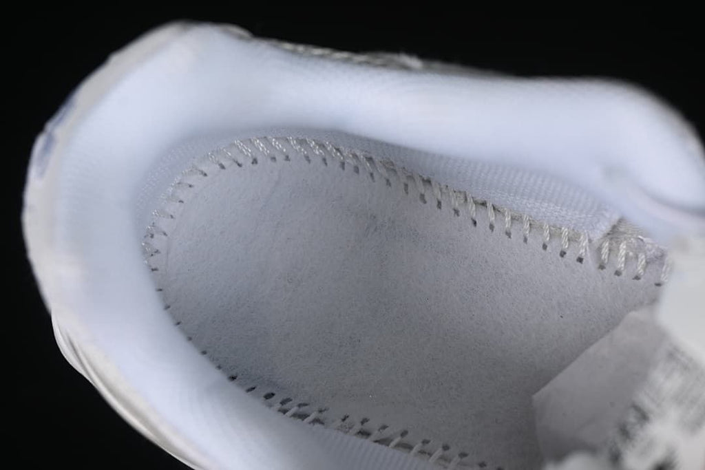 Close-up of the sneaker's padded interior and stitching.