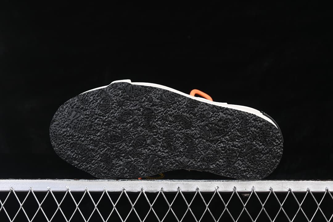 Underside view showing the black patterned outsoles.