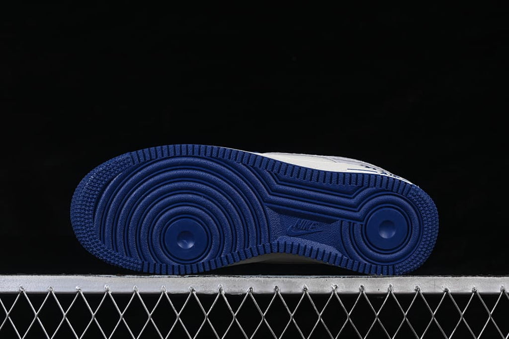 Underside view showing the navy circular-pattern outsole.