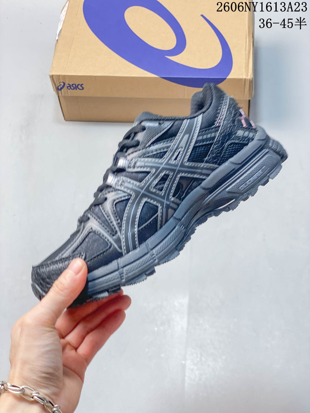 Side profile of a charcoal ASICS Gel-Kahana 8 FL sneaker