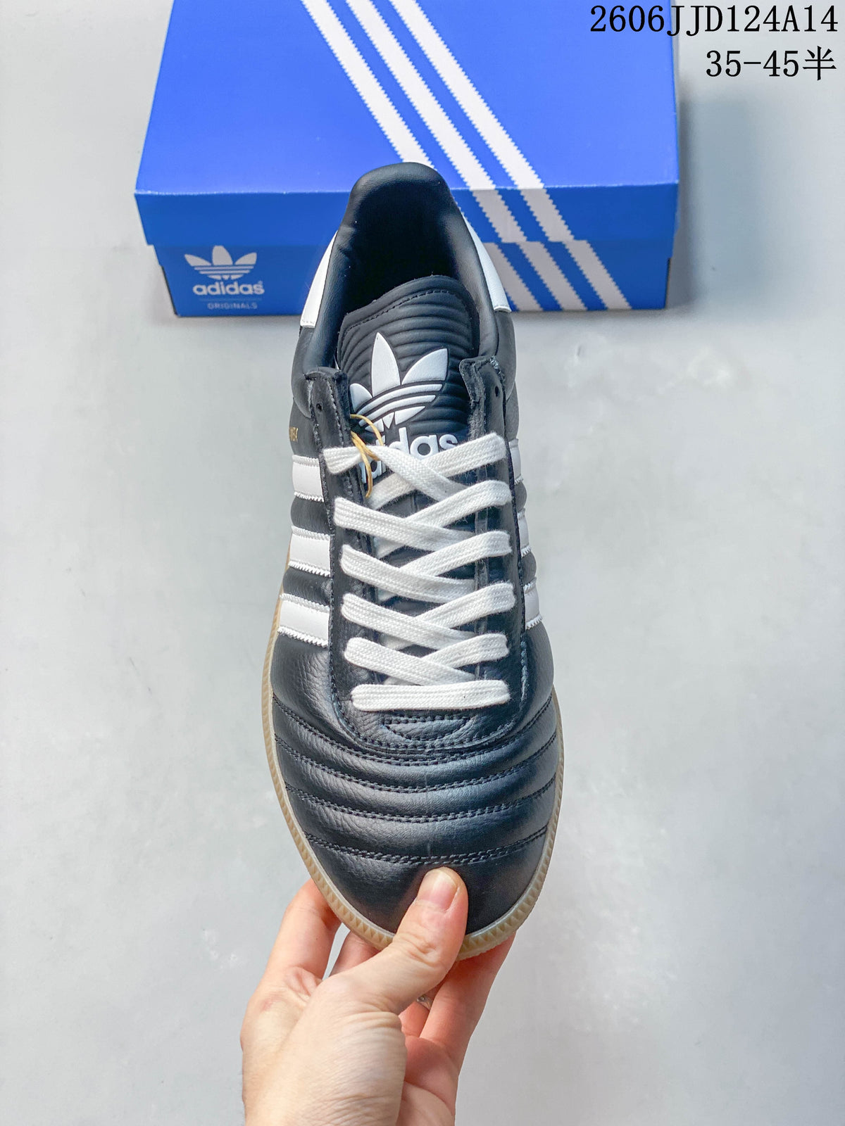 Top view showing the white laces, striped side panels, and padded tongue