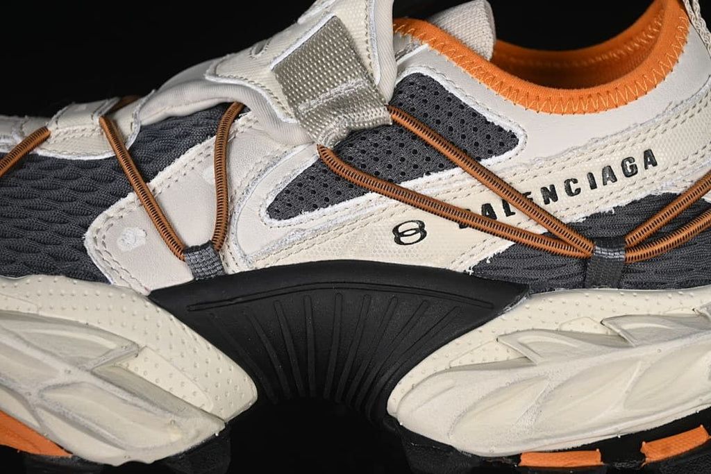 Side close-up of layered panels, elastic cords, and branding