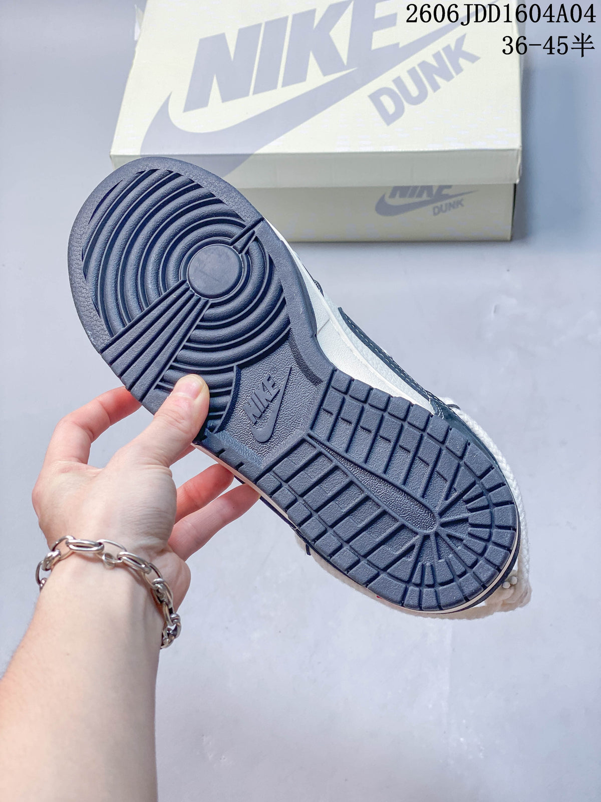 Close-up of the navy blue patterned outsole on a low-top sneaker.