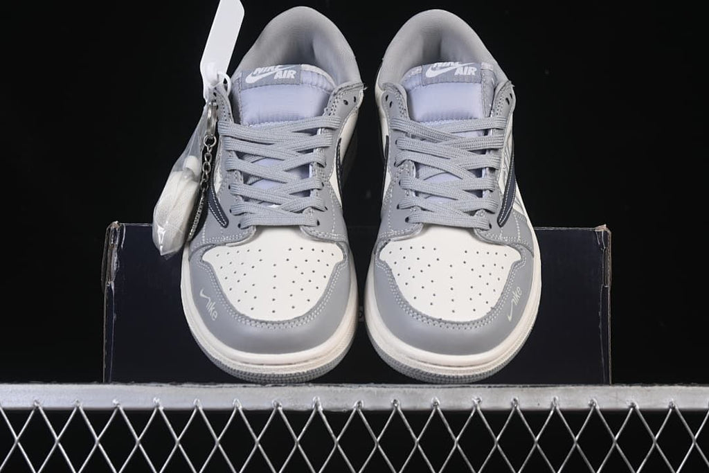 Front view of the pair showing perforated toe boxes, gray overlays, and laces.