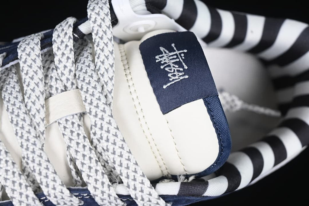 Close-up of patterned laces and branded tongue label
