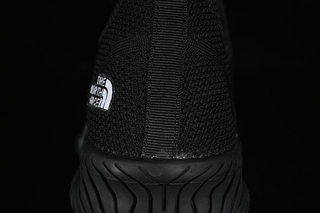 Rear view showing the heel pull tab and grooved sole