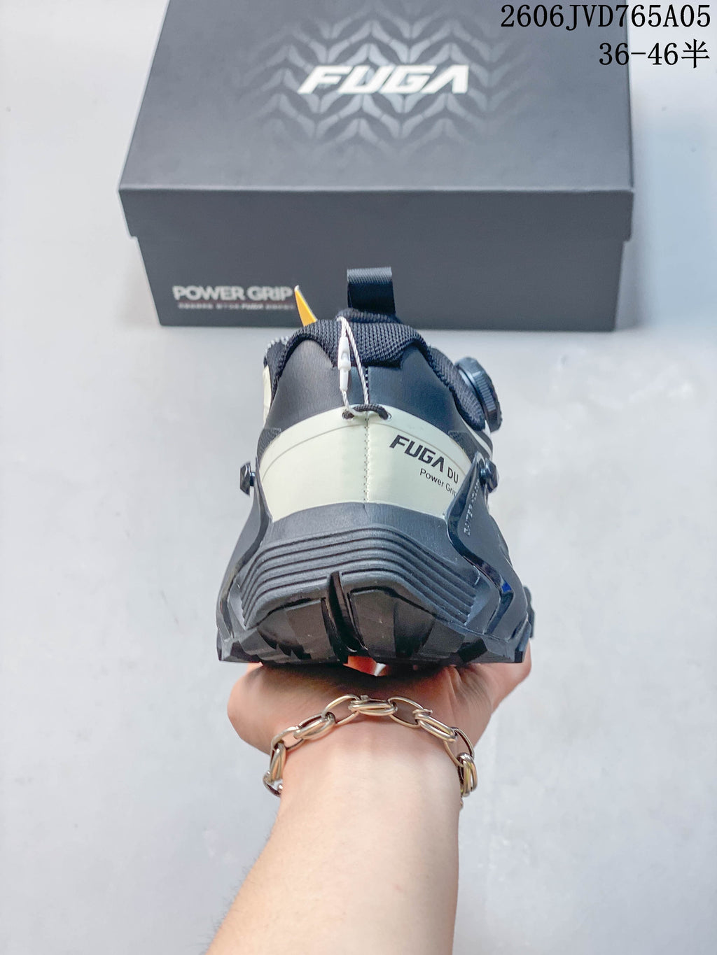 Rear view of the trail shoe showing the heel structure and outsole.
