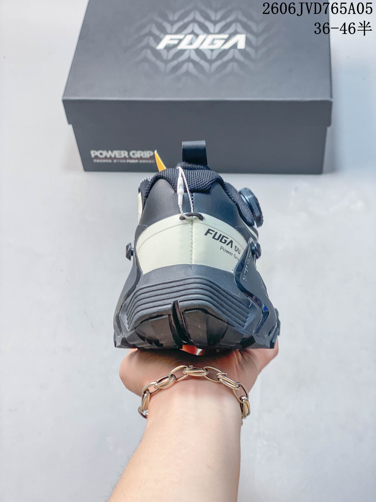 Rear view of the trail shoe showing the heel structure and outsole.
