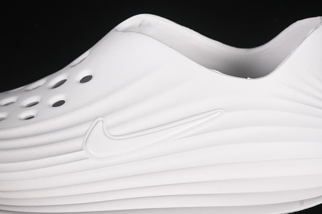Close-up of perforations and the side logo on the white clog