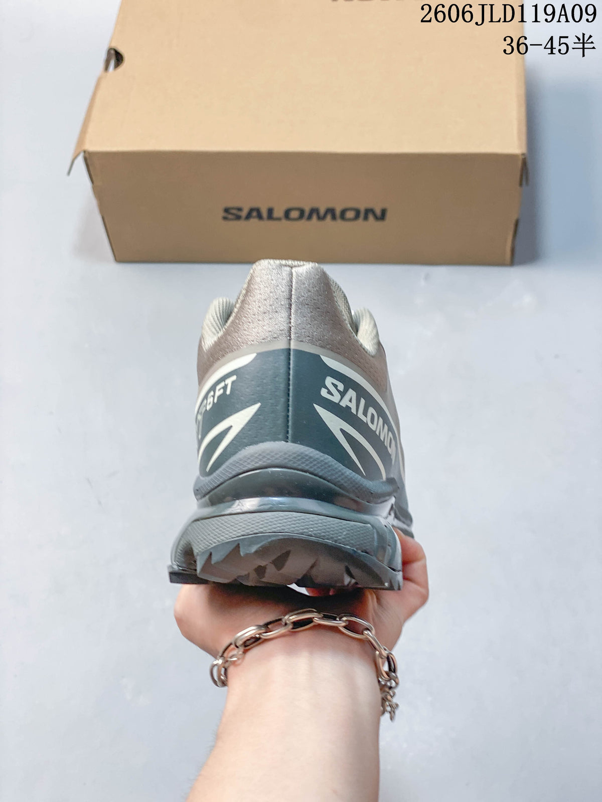 Rear view of a grey Salomon XT-6 FT shoe showing heel branding and outsole.