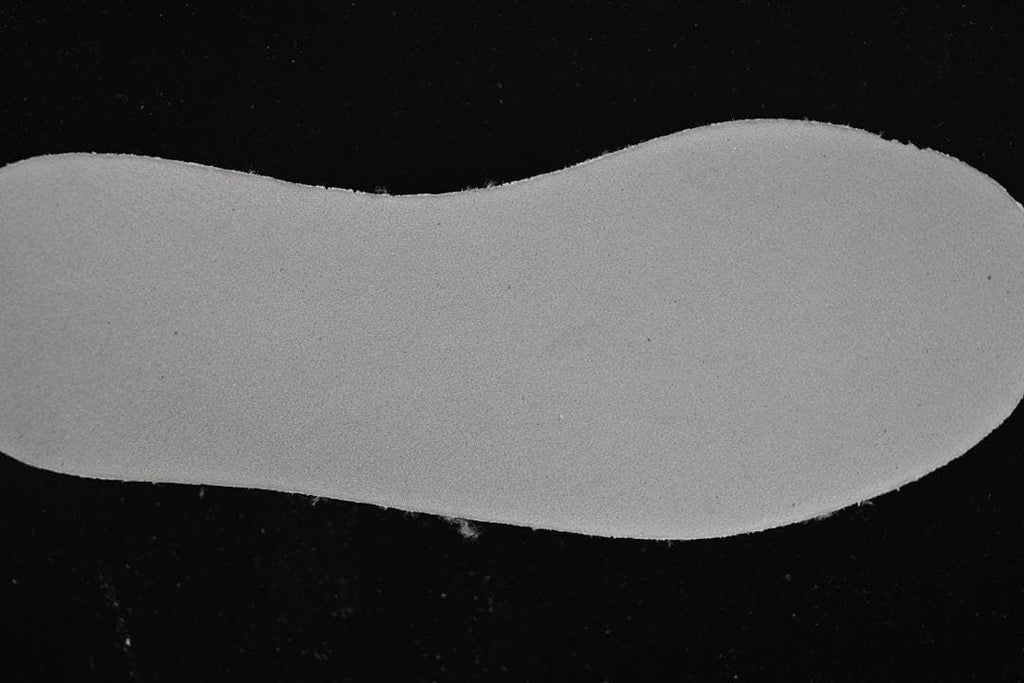 Close-up of a plain light-colored shoe insert