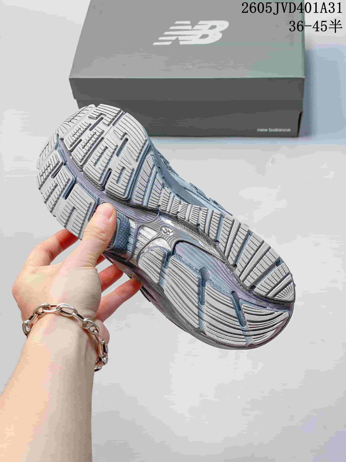 Close-up of the segmented outsole on a silver-gray sneaker.