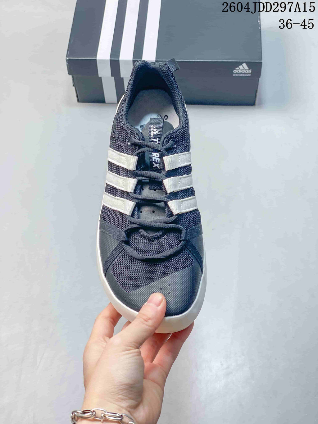 Front view of the dark gray adidas Terrex CC Boat with three white stripes