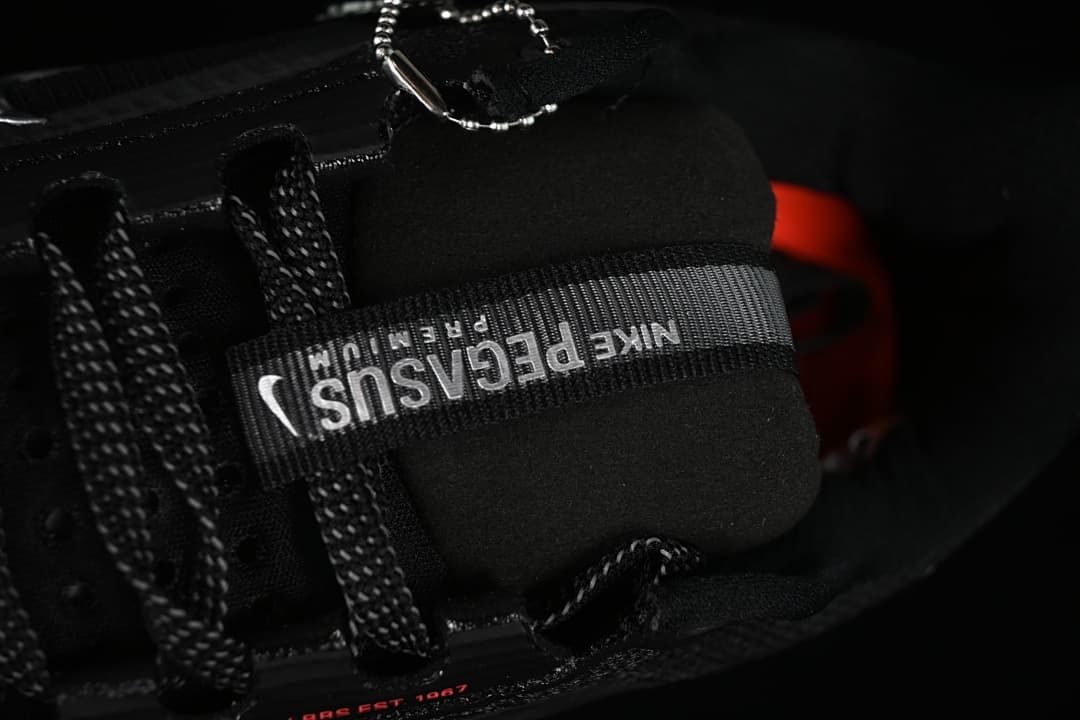 Close-up of the tongue label and black laces