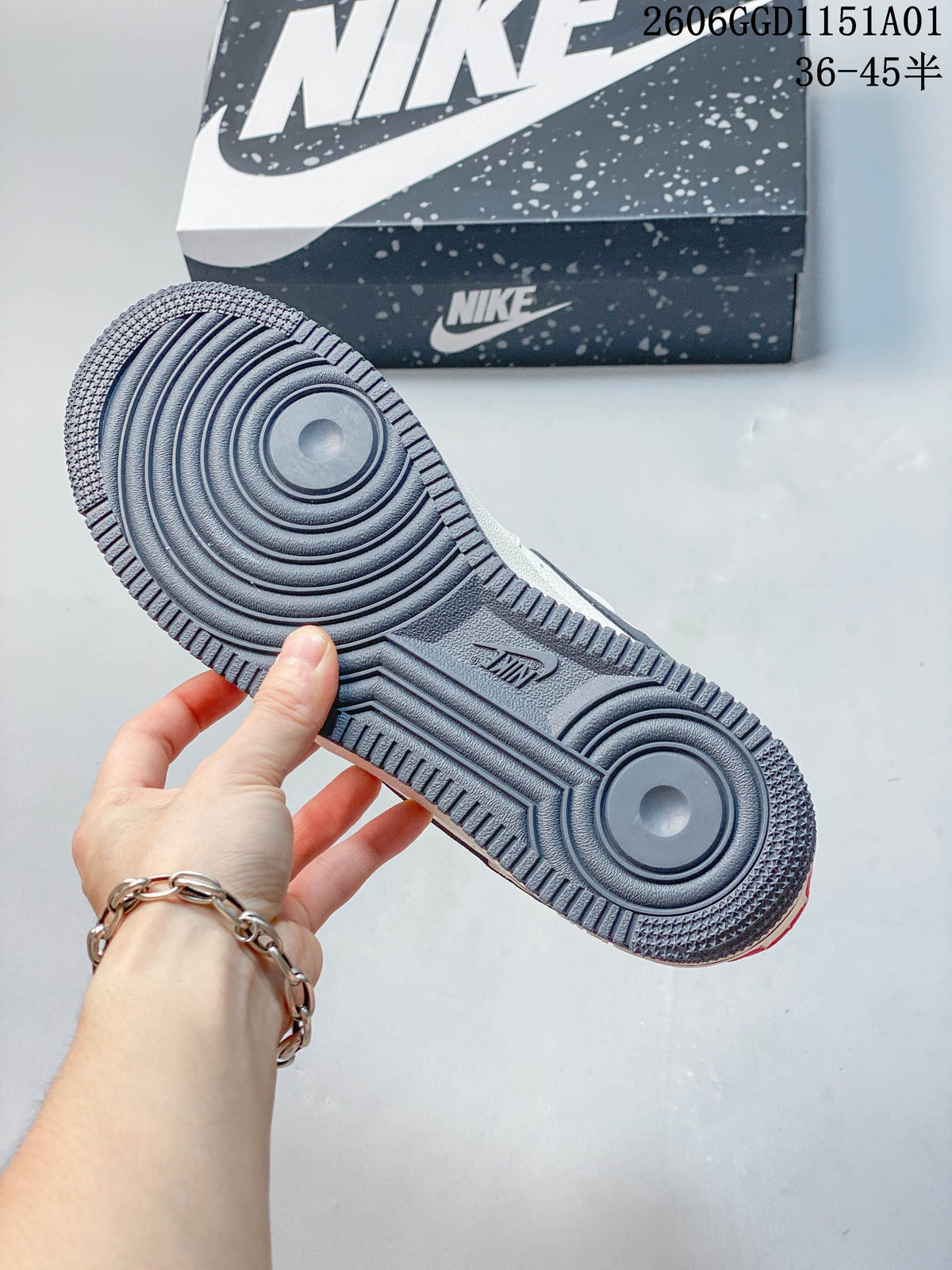 Close-up of the gray-blue circular-tread outsole on a Nike Air Force 1 '07 LV8 sneaker.