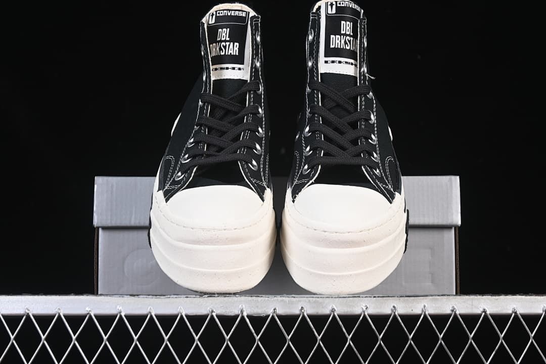 Front view of the pair showing the white toe caps and thick soles