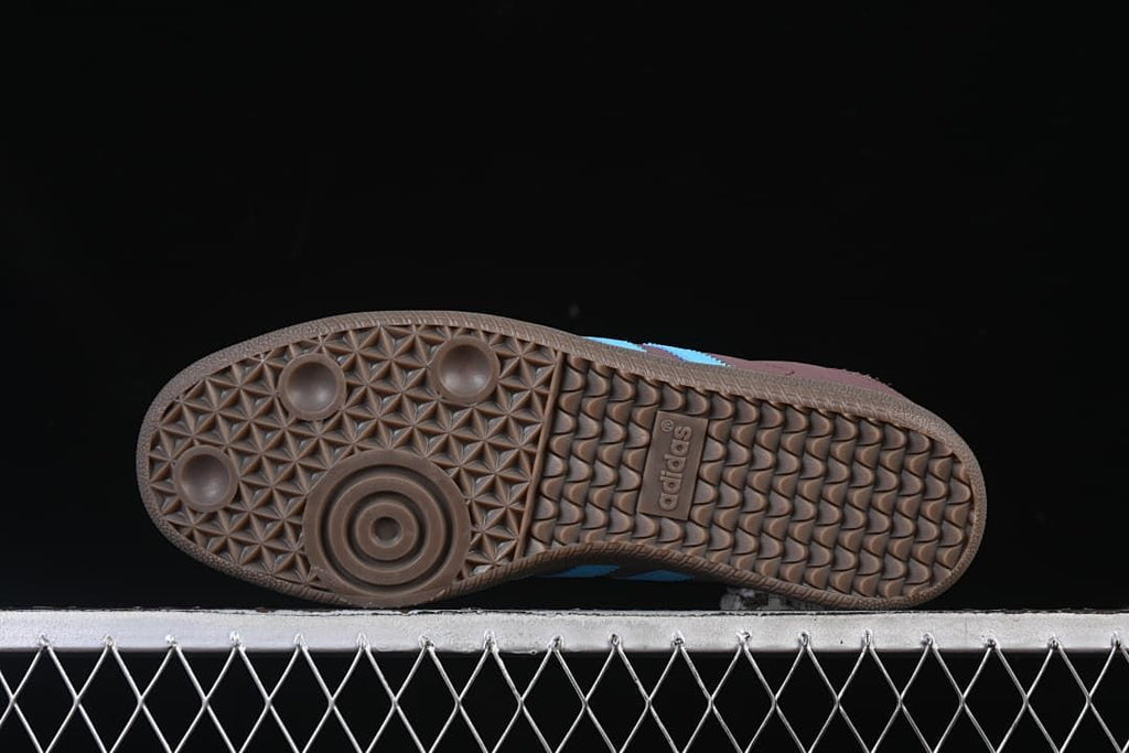 Underside view showing the brown outsole tread pattern.