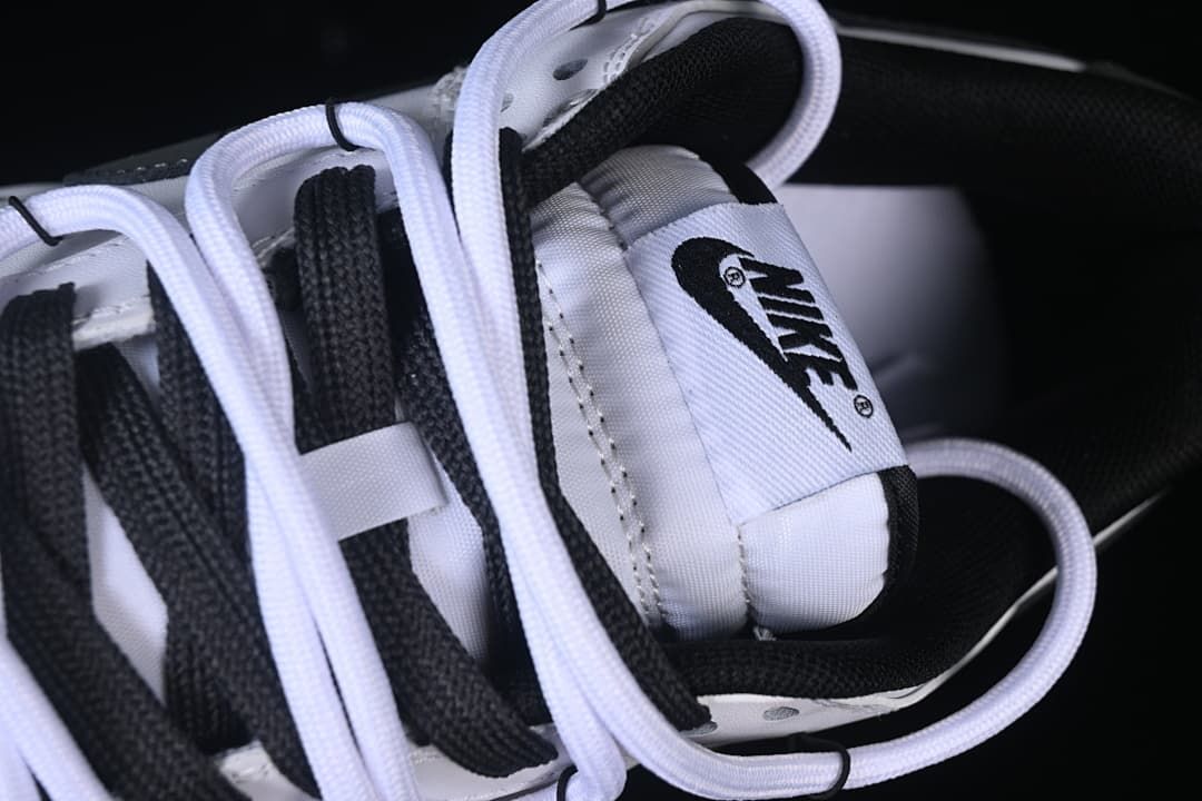 Close-up of tongue branding and layered laces