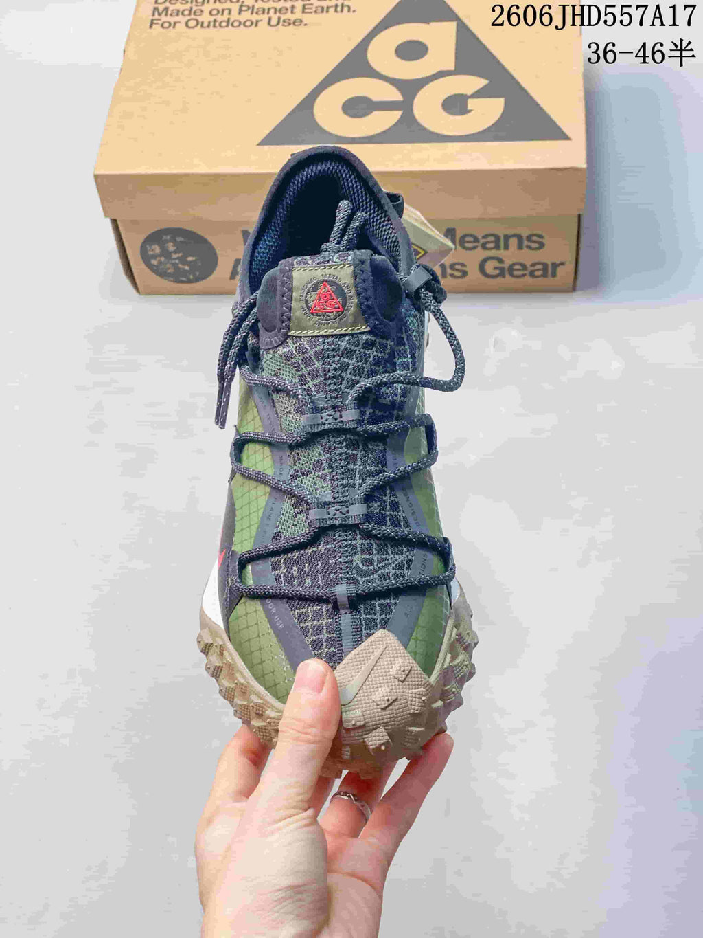Front view of a Nike ACG Mountain Fly sneaker showing its lace-up design and layered upper.