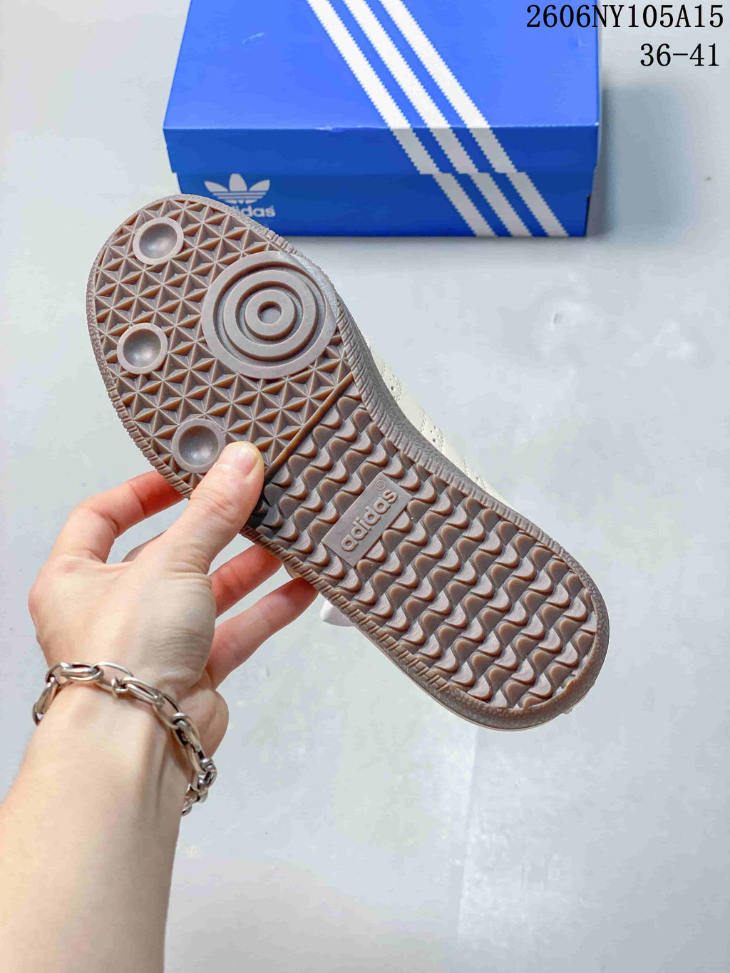 Close-up of the gum-colored outsole on a beige Samba Jane sneaker.