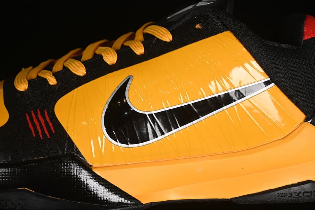 Close-up of the yellow side panel and black Swoosh