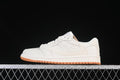 Side view of an off-white low-top sneaker with embossed side detailing and a gum-colored outsole