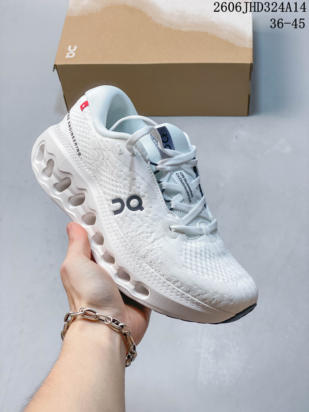 Side view of a white On Cloudtilt shoe with an open-channel midsole