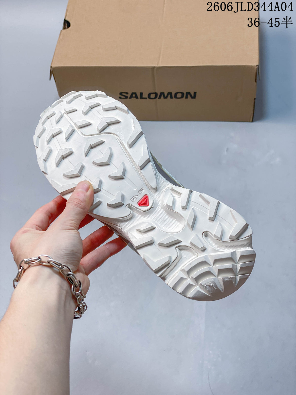Underside of a Salomon XT-6 shoe showing the lugged outsole.